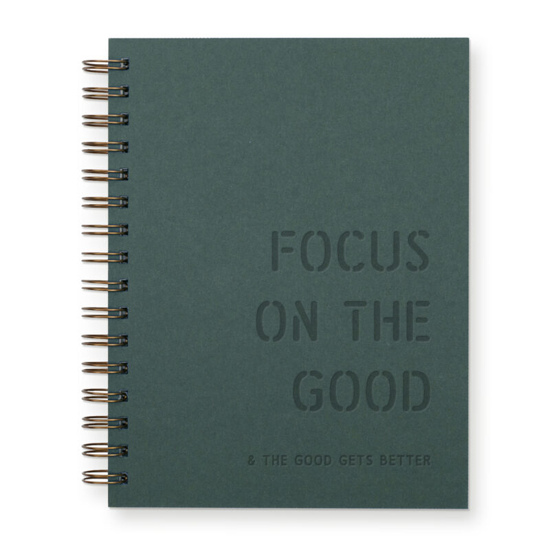 Focus on the good notebook with forest green cover