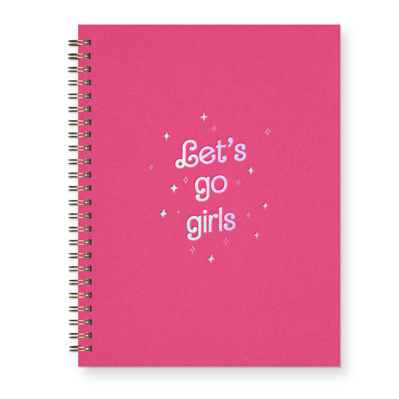 A hot pink journal with an iridescent foil design that says "Let's go girls" with surrounding sparkles