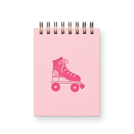 A light pink miniature notebook with a hot pink roller skate on it