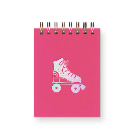 A hot pink miniature notebook with an iridescent foil roller skate on it