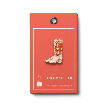 Western-themed enamel pin of a pink and red cowboy boot