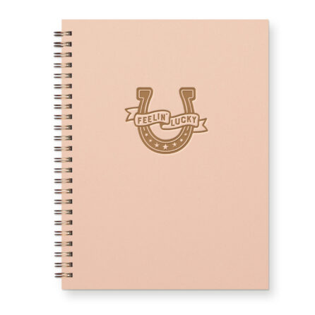 Cowboy inspired lined journal with horseshoe on cover that reads "feeling lucky"